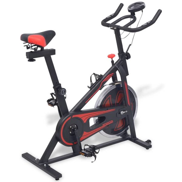 Bicicleta de entrenamiento con sensores de pulso negros y rojos.
