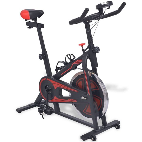 Bicicleta de entrenamiento con sensores de pulso negros y rojos. - Imagen 2