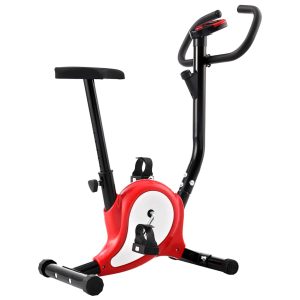 Bicicleta estática con correa de resistencia roja.