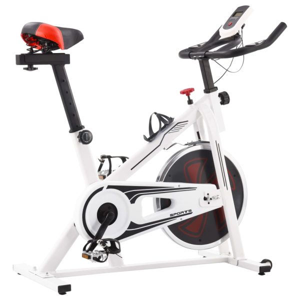 Bicicleta de entrenamiento con sensores de pulso blancos y rojos.